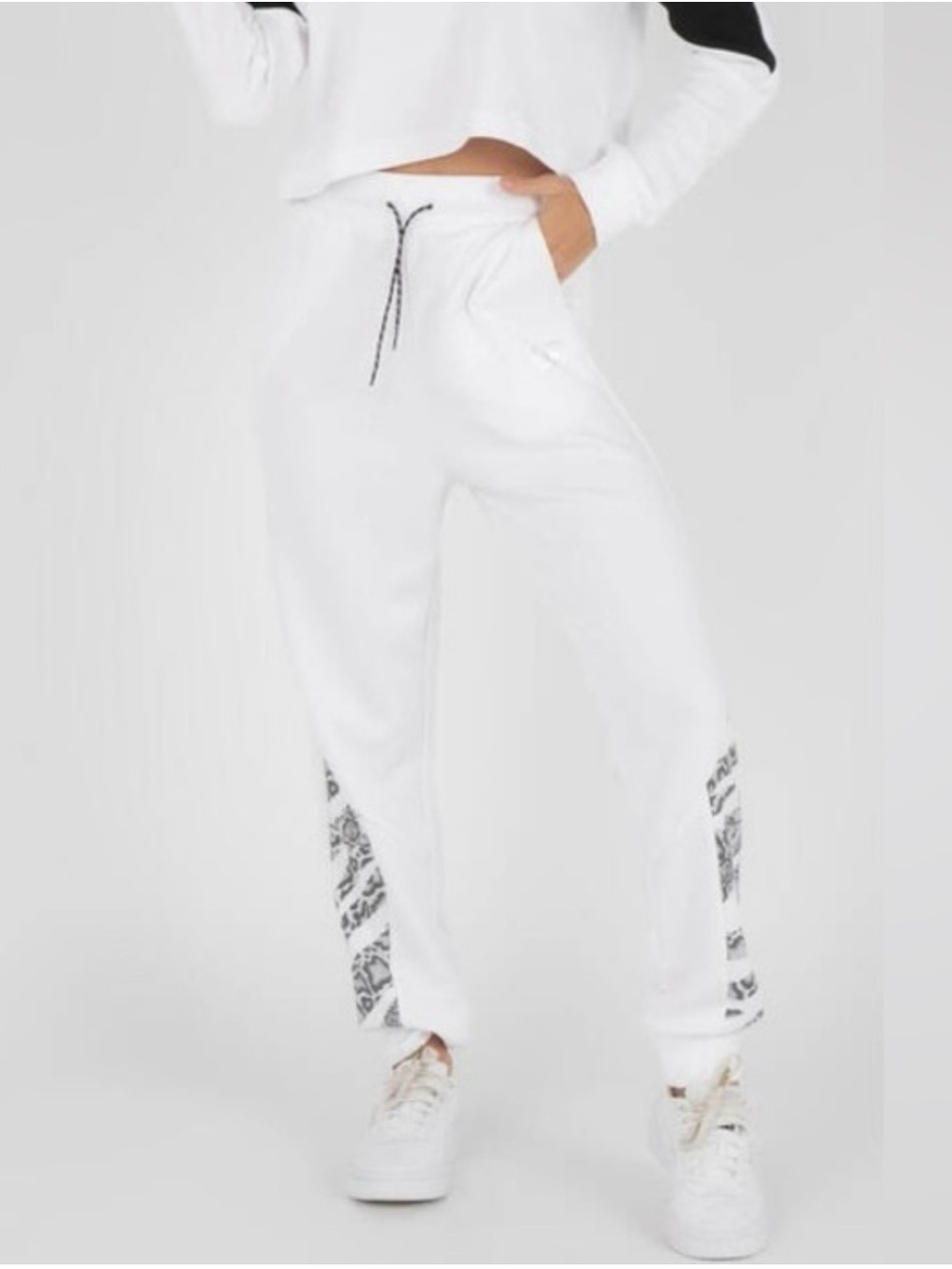 Puma Women's White Jogger Sweatpants with Black Detailing on leg